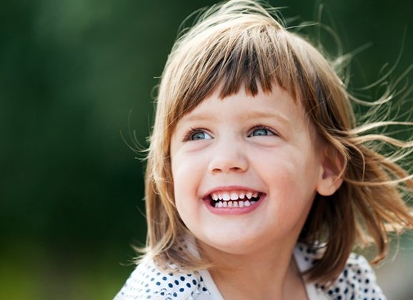 a closeup of a child’s smile