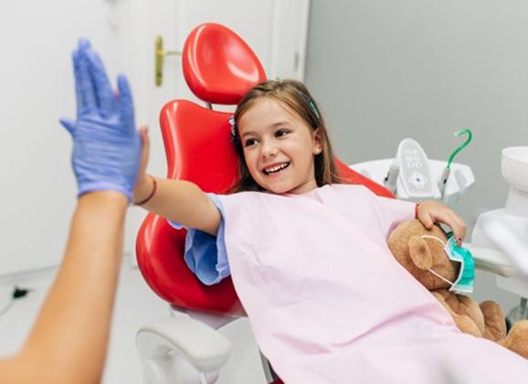 a child receiving their mouthguard