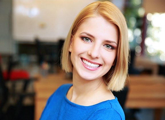 Woman smiling after cosmetic bonding treatment