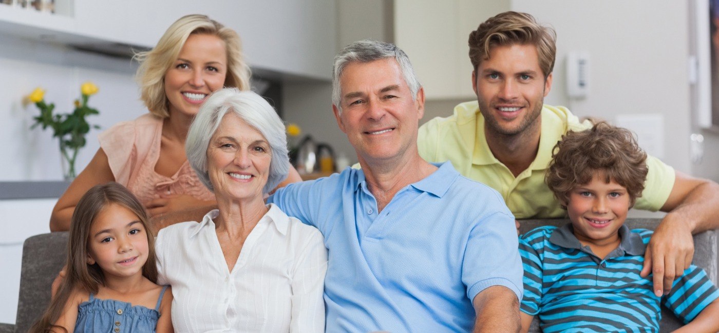 Three generations of family smiling together