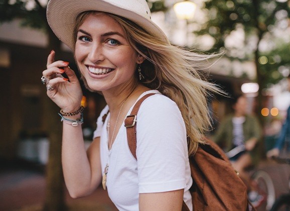 Woman smiling after tooth-colored filling placement