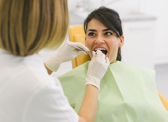 Woman receiving root canal therapy