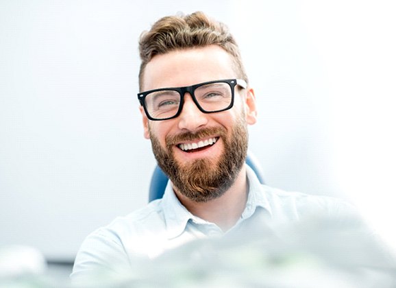 Smiling young man with tooth-colored fillings in Brooklyn