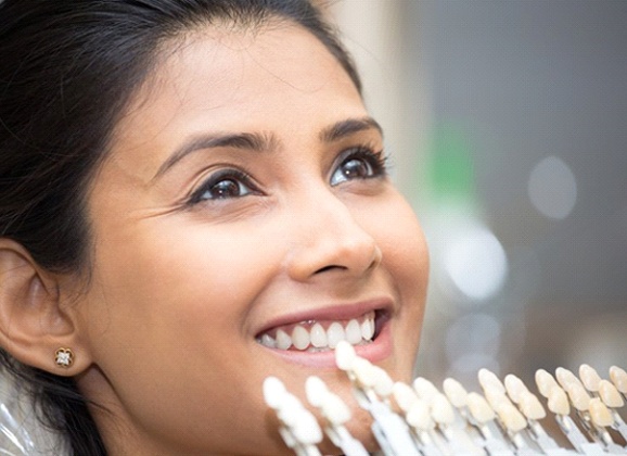 Woman getting porcelain veneers in Brooklyn