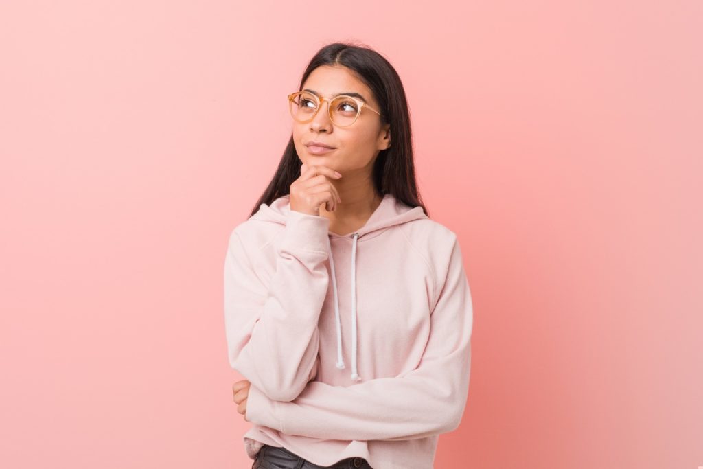 Closeup of teen with glasses wondering