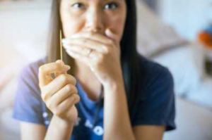 a person using a toothpick on their teeth 